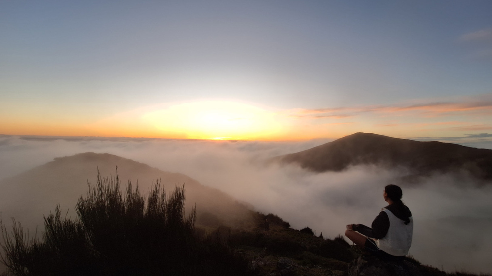 Traveler observing the sunset from a scenic destination